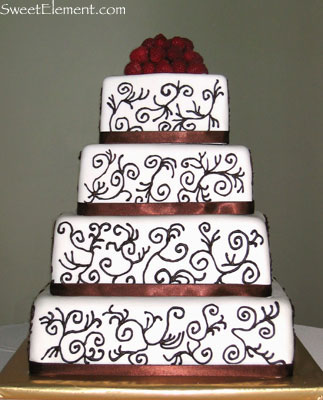 Tagged cake scroll work piped design on cake 